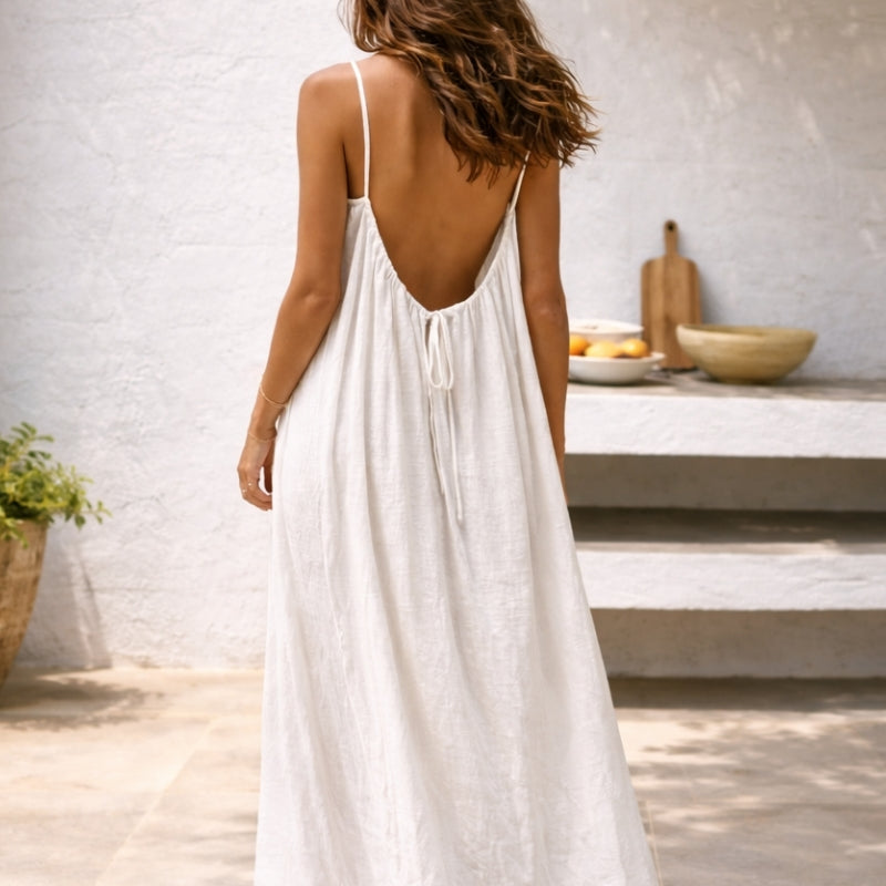 Versatile black backless cami dress with adjustable straps, great for women's parties and evening wear.