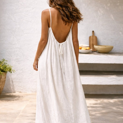 Versatile black backless cami dress with adjustable straps, great for women's parties and evening wear.