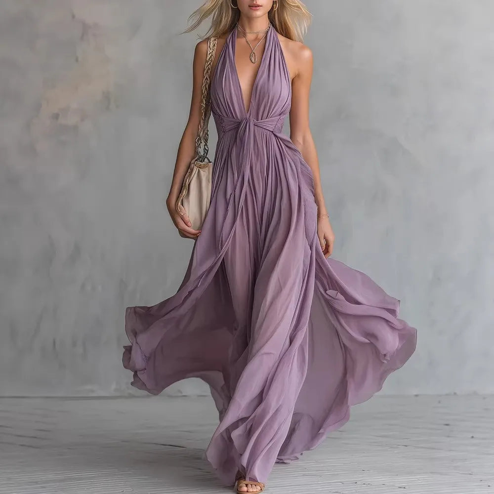 Elegant women's backless halter maxi dress with pleated side slit, perfect for evening wear or formal events.
