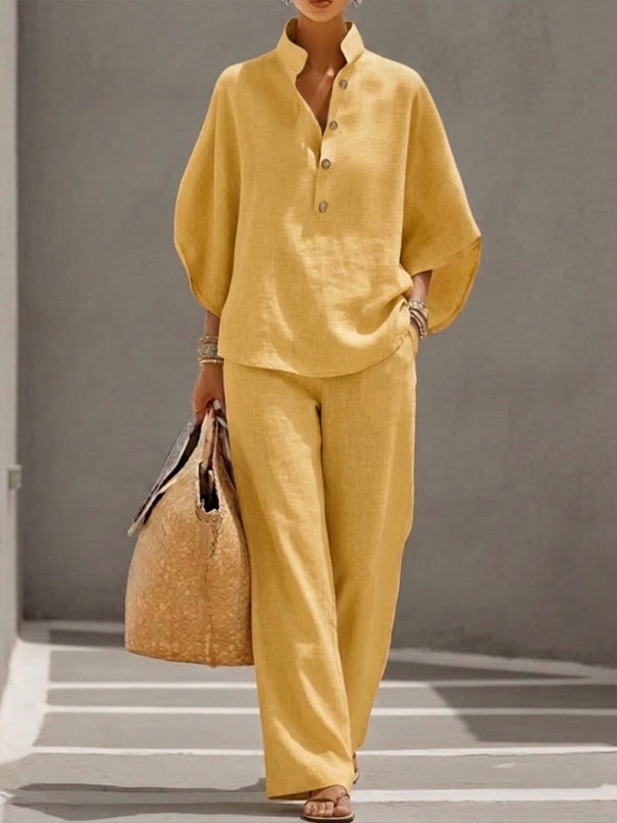 Flowy wide-leg trousers matching a batwing blouse, a comfortable & elegant women's two-piece clothing set.