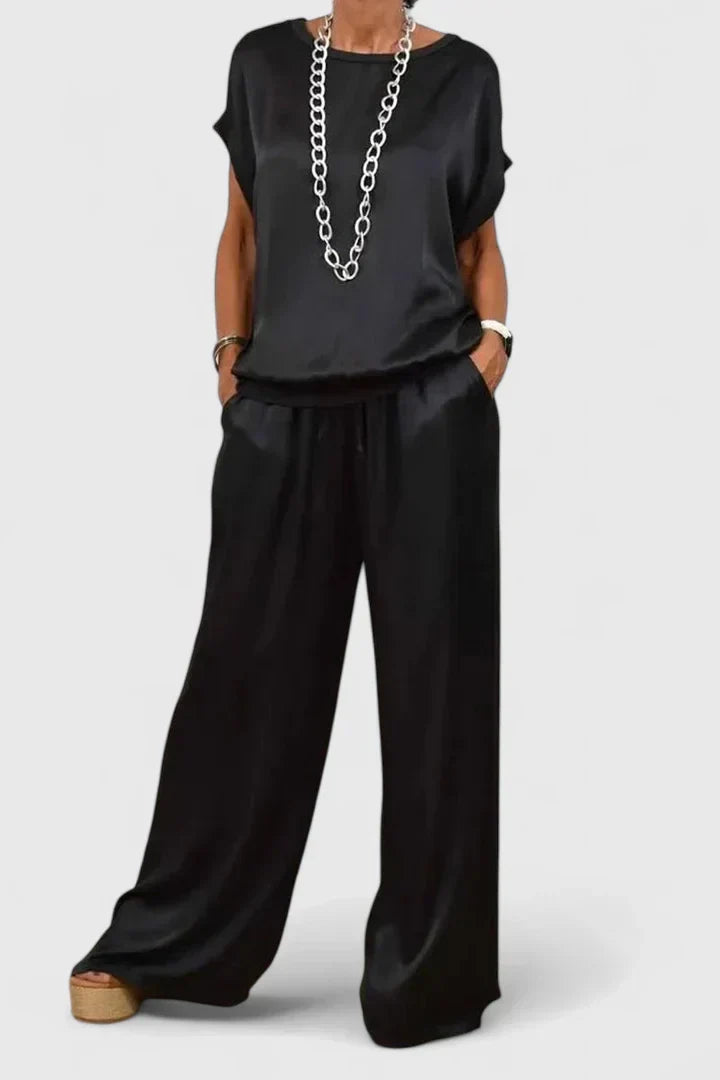 Elegant women's batwing top and wide leg pant matching set in a solid color for versatile fashion.