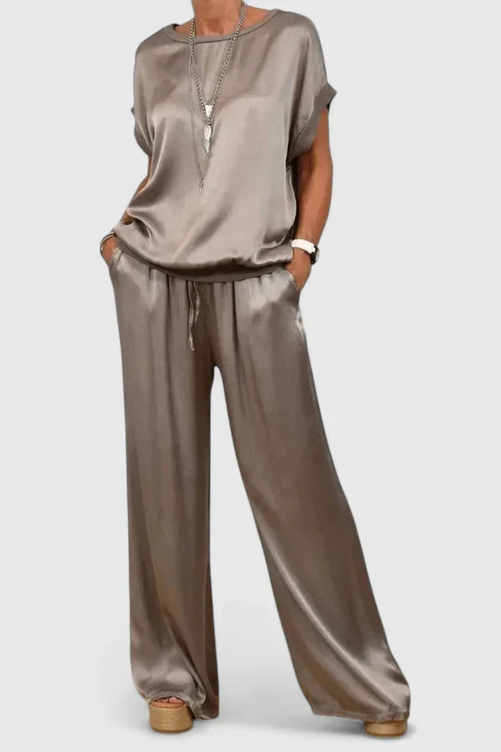 Comfortable two-piece batwing sleeve top and wide leg trouser set, perfect for casual chic or travel wear.