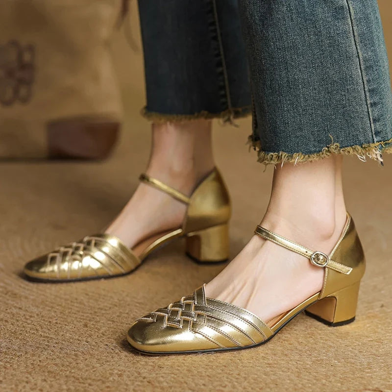 Women's sophisticated beige block heels with an adjustable ankle strap, great for professional looks.