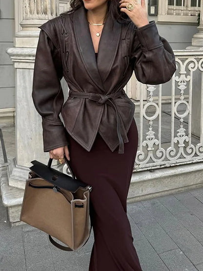 Stylish women's belted jacket, emphasizing the waist. Versatile outerwear for a chic, elegant look.