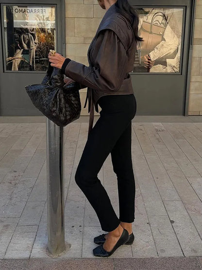 Chic women's belted jacket, a key piece of stylish outerwear for versatile fashion.