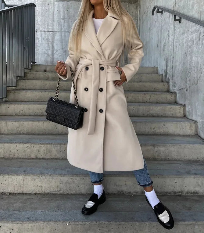 Elegant women's belted long trench coat, tailored for office & sophisticated style, perfect fall/winter outerwear.