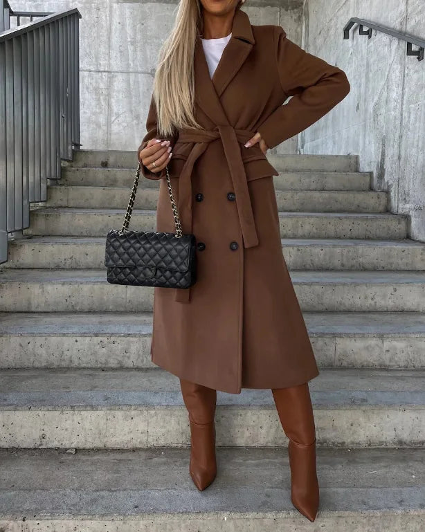 Khaki women's elegant long trench coat, a versatile belted outerwear piece for stylish office or winter fashion.