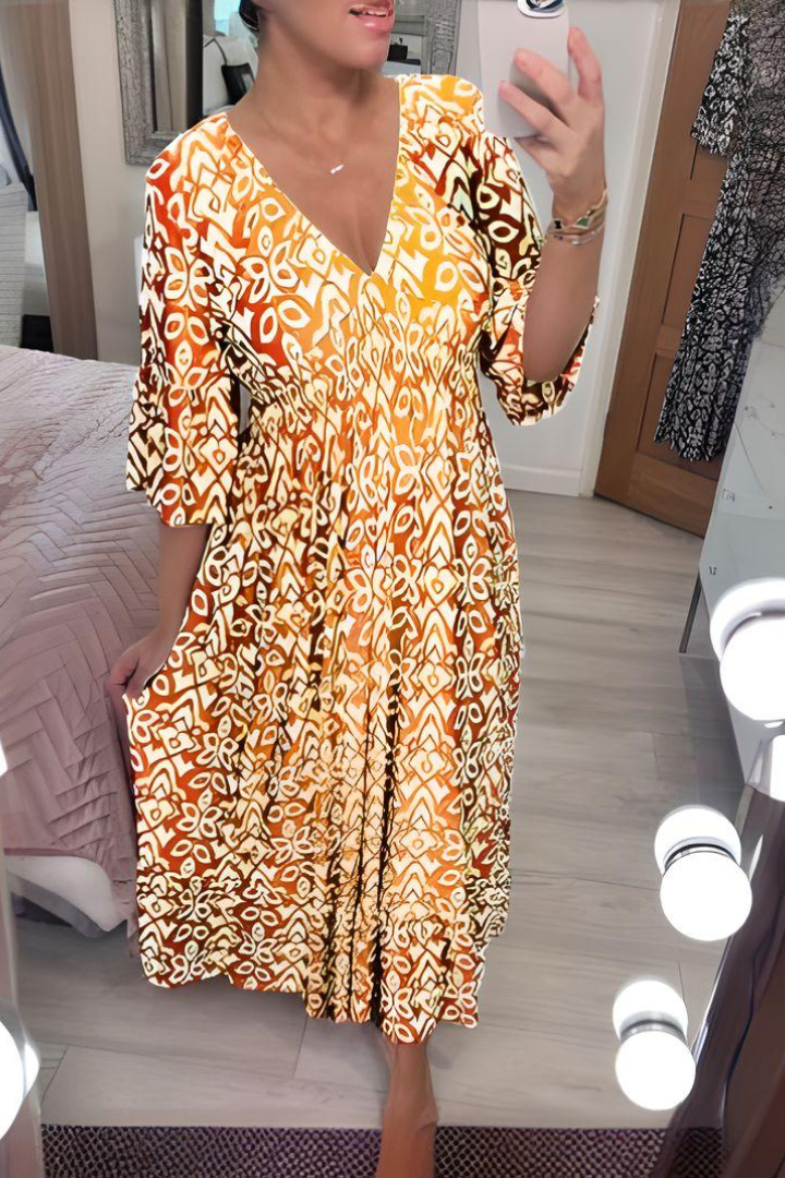 Elegant women's belted printed midi dress, perfect for spring/summer occasions. Flattering fit & vibrant design.