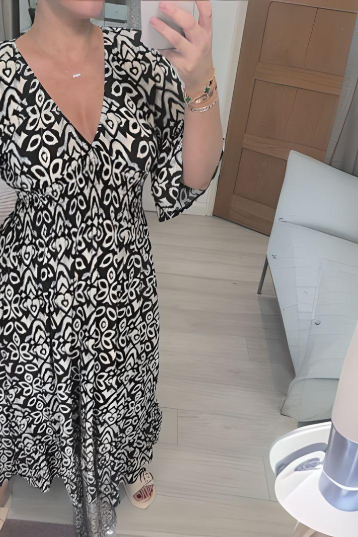 Women's flattering midi dress with vibrant print & chic belt. Ideal elegant spring/summer party or formal wear.