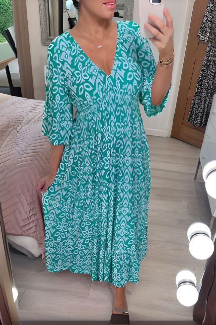 Beautiful women's printed midi dress with an elegant belted design. A flattering formal or party dress for spring.