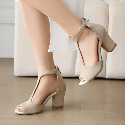 Pair of elegant women's black block heels. Stable, comfortable open-toe t-strap for versatile party & formal wear.