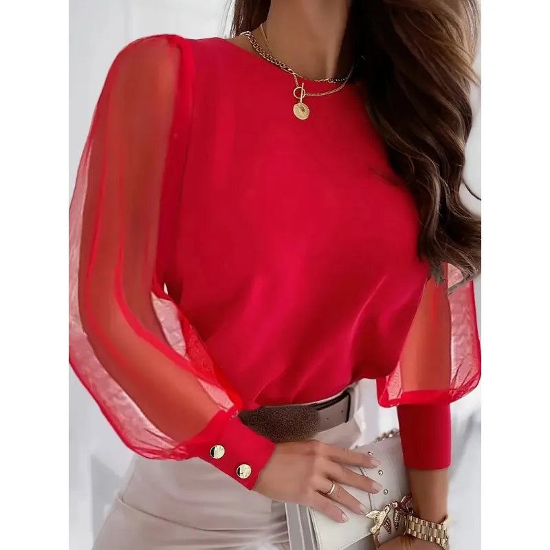 Women's fashion blouse with elegant sheer long sleeves, round neck & intricate appliqué detail. Stylish party wear top.