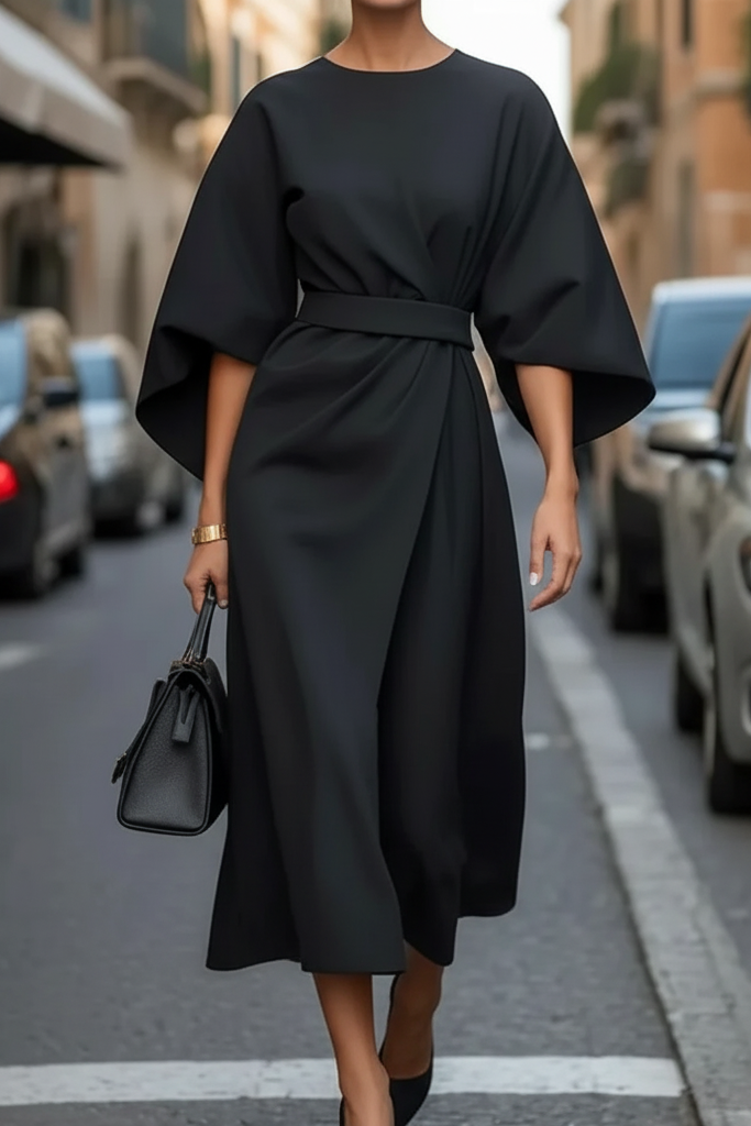 Chic women's elegant evening dress. Black midi cocktail dress for formal parties and sophisticated events.