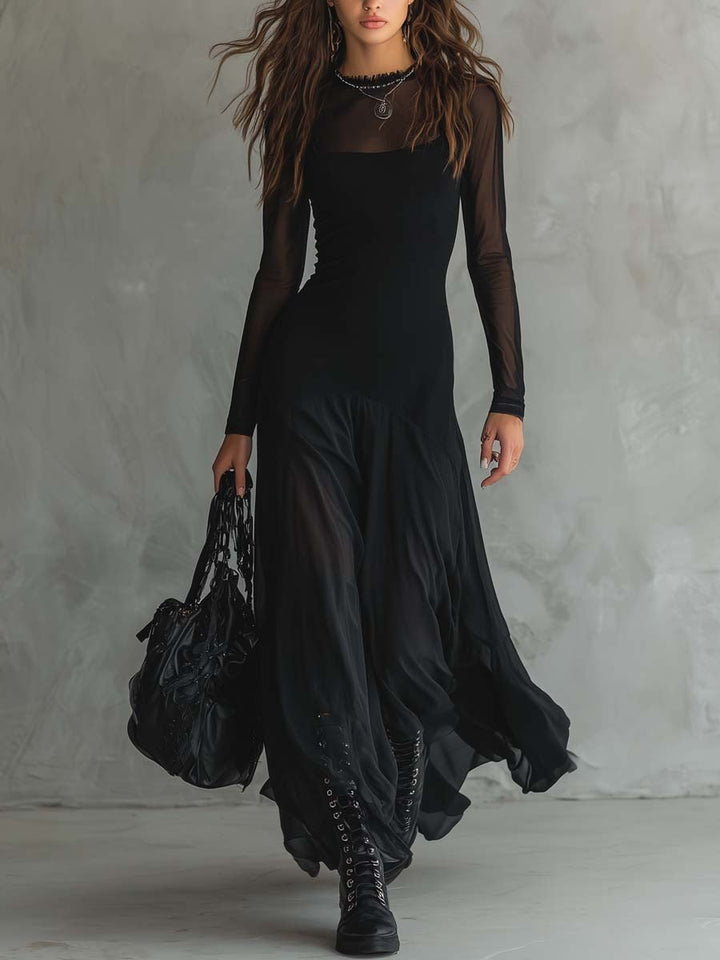 Elegant women's black flowing maxi dress with long sleeves, perfect for evening wear or special occasions.