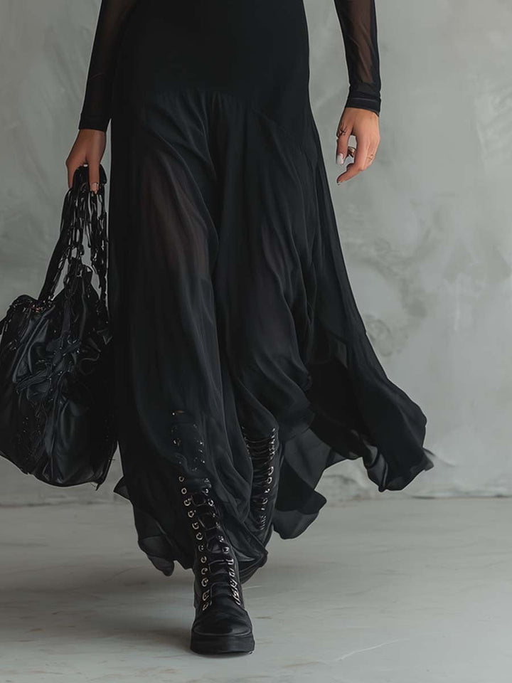 Sophisticated women's black maxi dress; elegant flowing fabric & long sleeves for a chic, special occasion look.