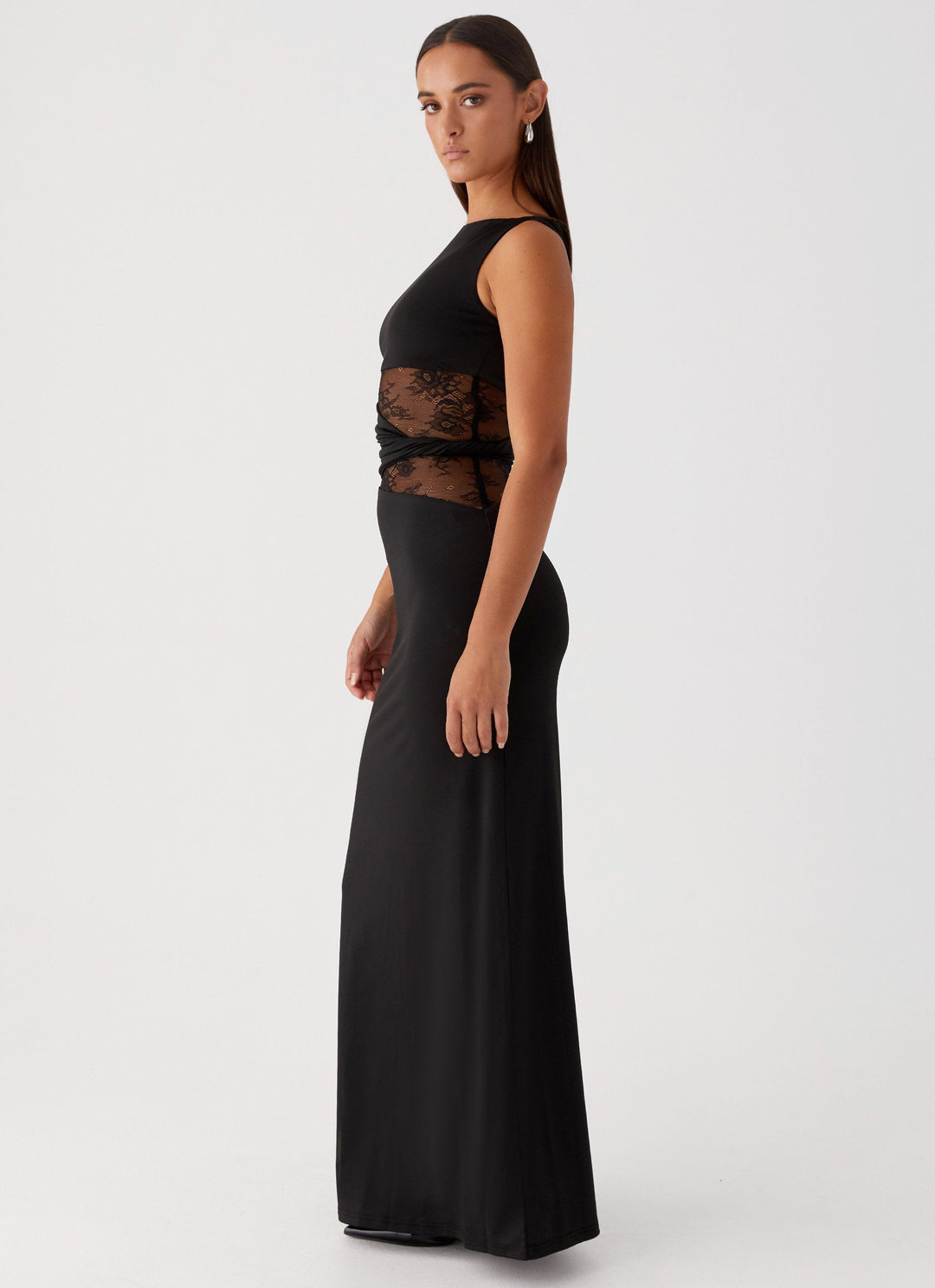 Stunning white formal maxi dress for women, featuring a boat neck, lace details & elegant cut-outs. Ideal for evening.