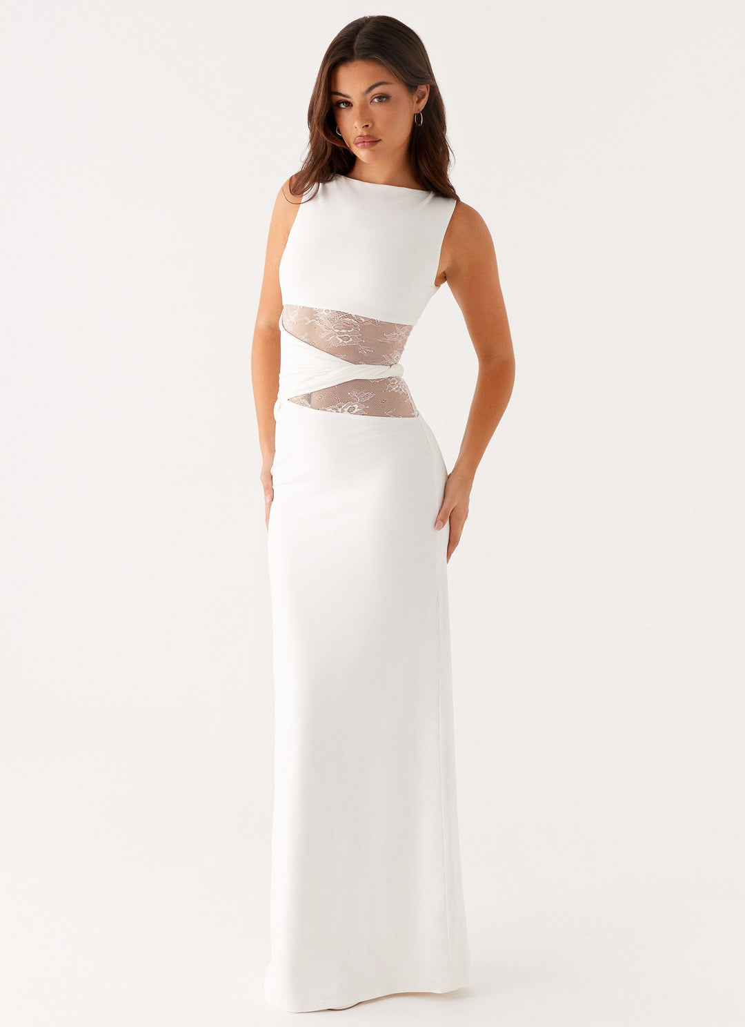 White elegant women's party dress, a stunning lace cut out maxi gown with a boat neck for formal evenings.