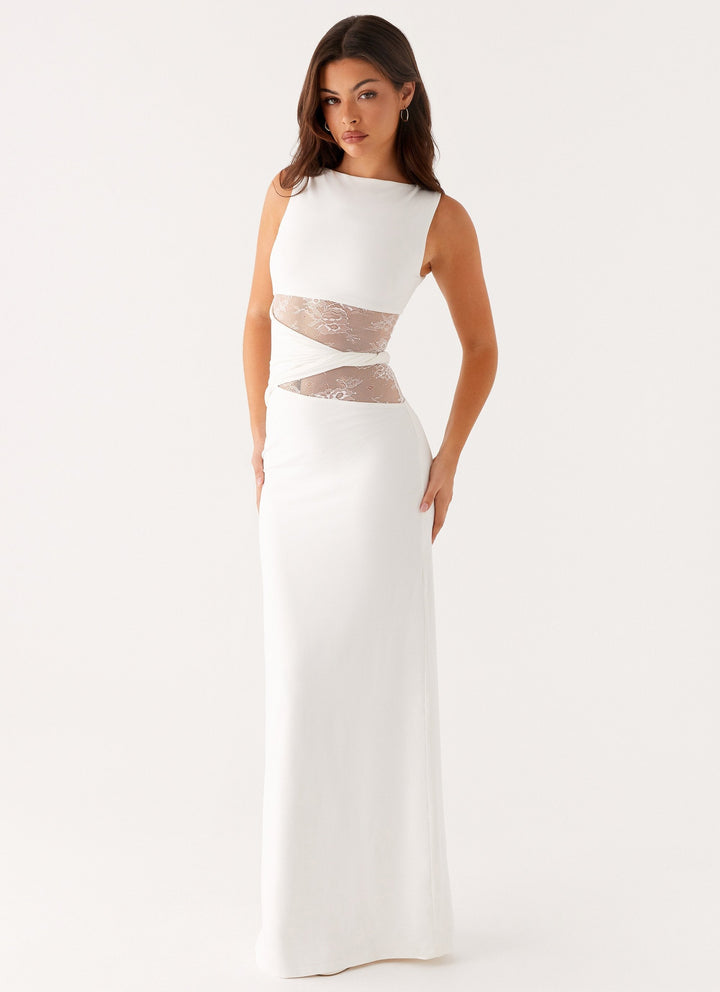 White elegant women's party dress, a stunning lace cut out maxi gown with a boat neck for formal evenings.