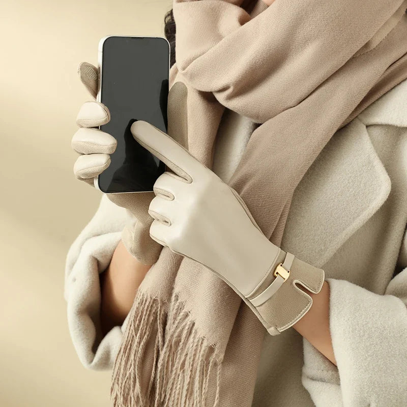 Warm women's touchscreen leather gloves, combining winter elegance with practical tech use.