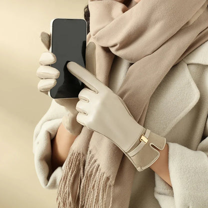 Warm women's touchscreen leather gloves, combining winter elegance with practical tech use.