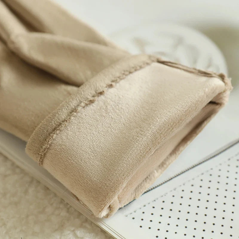 Women's sleek black leather touchscreen gloves, providing warmth, style & device control.