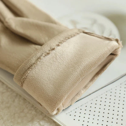 Women's sleek black leather touchscreen gloves, providing warmth, style & device control.