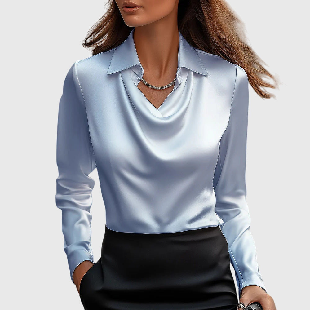 Beautiful floral pleated blouse for women. Elegant top with a flowing fit, perfect for chic style.