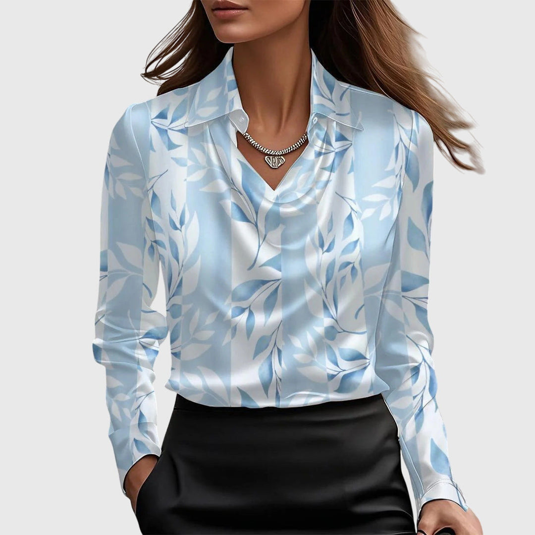 Women's elegant black blouse with pleated neckline. Chic, flowing fit for versatile fashion.