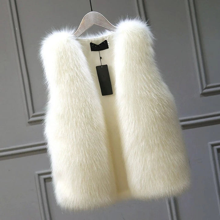 Elegant women's black winter vest, perfect for layering. Luxurious warmth and chic fashion outerwear.