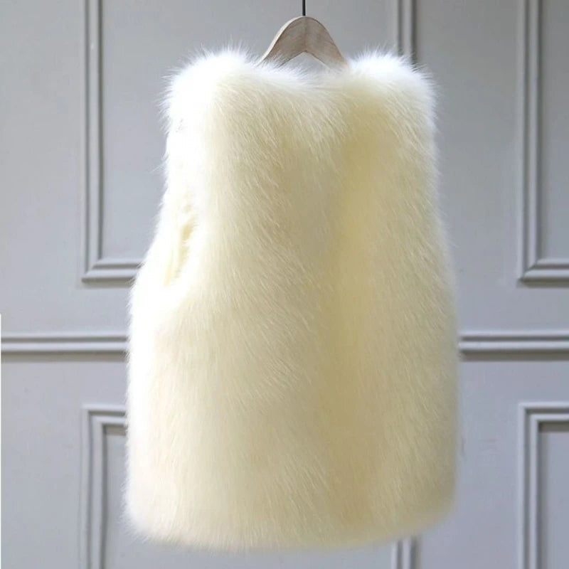 Chic beige women's winter vest, sleeveless for elegant layering. Offers comfort and stylish outerwear.