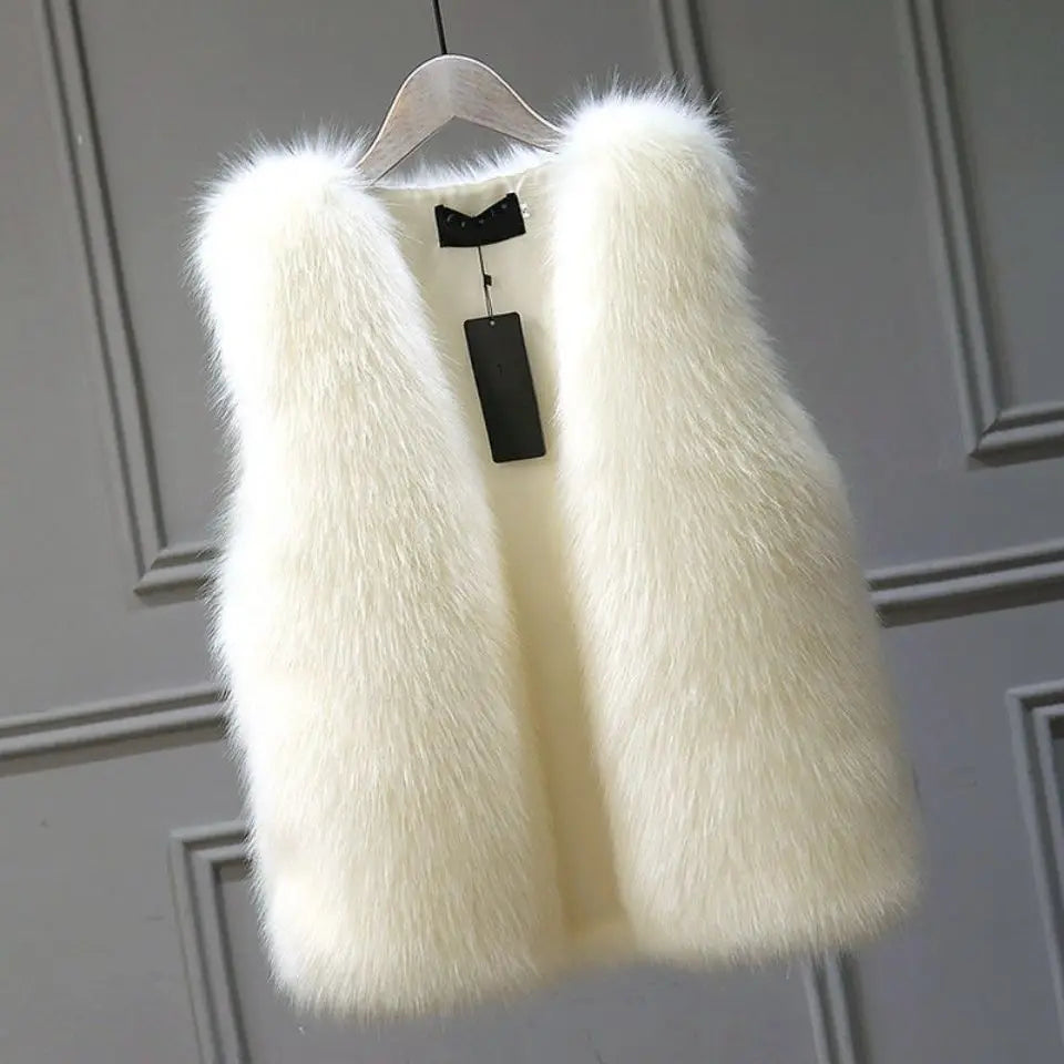 Warm & elegant women's sleeveless vest. Perfect chic outerwear for winter layering and comfortable style.