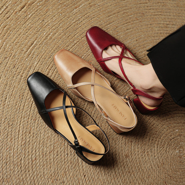 Side view of elegant women's block heels, highlighting the adjustable strap and closed-toe design.