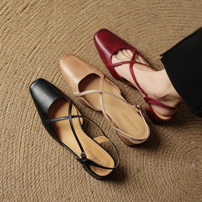 Side view of elegant women's block heels, highlighting the adjustable strap and closed-toe design.