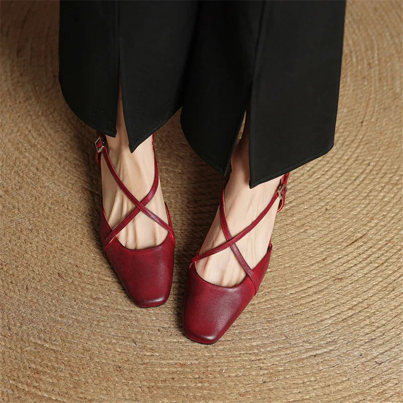 Red elegant closed-toe block heels for women, featuring a comfortable adjustable strap.