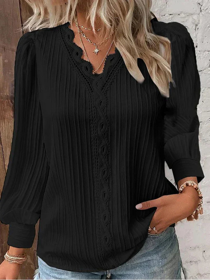 Elegant women's blouse with delicate lace accents, perfect for sophisticated spring & summer fashion.