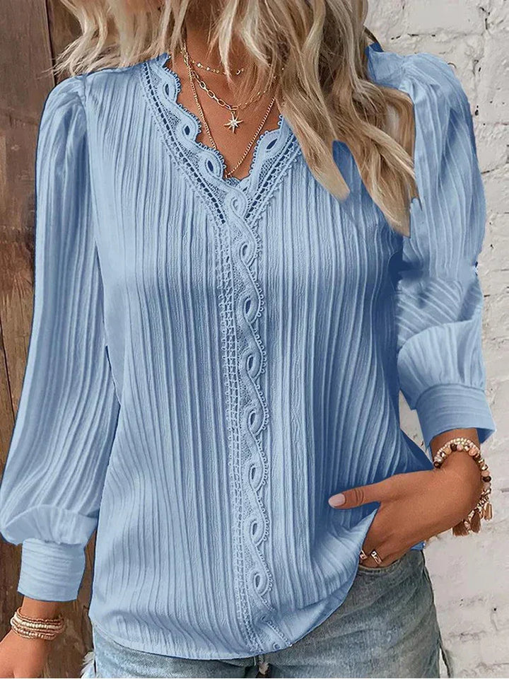 Versatile women's blouse with delicate lace, comfortable for both casual wear & dressy occasions.