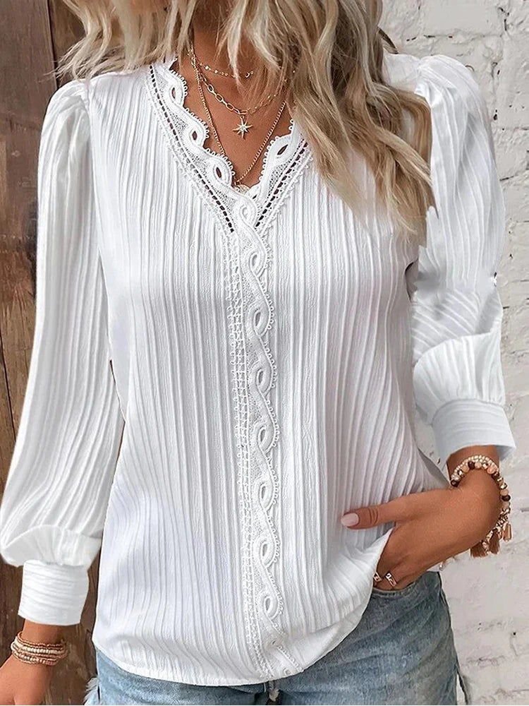 Sophisticated women's blouse with lace accents, great for a dressy top or elegant casual summer fashion.