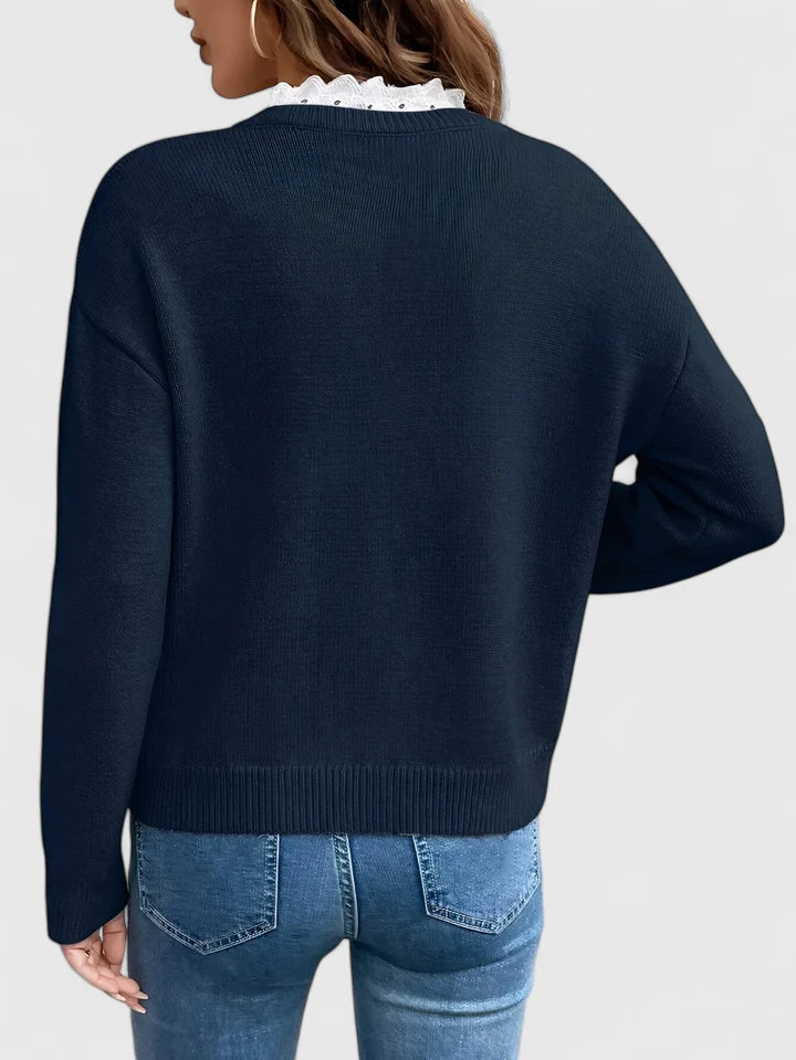 Chic women's work blouse featuring elegant lace detail. This comfortable, long-sleeve top offers a versatile, stylish look.