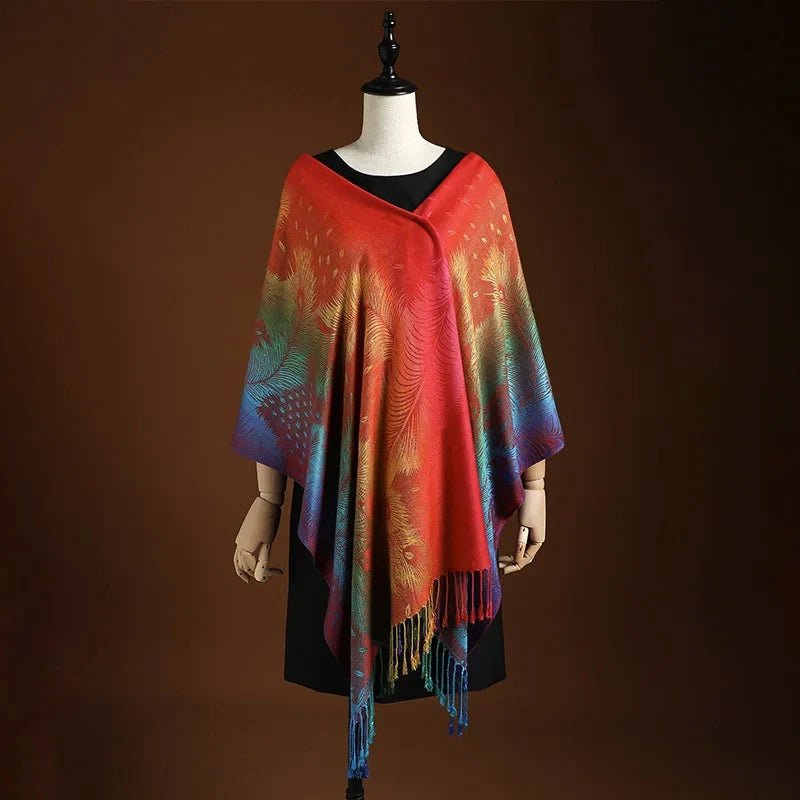 Close-up of a women's red and blue peacock pattern shawl, showcasing detailed design and soft fringe.
