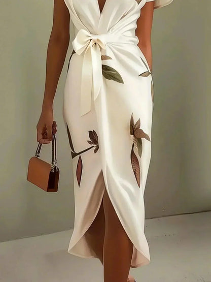 Graceful women's floral midi dress, a sophisticated spring/summer occasion dress with flutter sleeves.