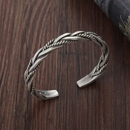 Vintage style women's adjustable braided cuff bracelet. An elegant statement piece for any fashion ensemble.