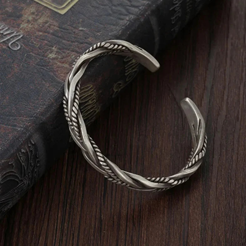 Fashionable women's braided cuff bracelet, adjustable for comfort. Vintage style accessory, a versatile statement.