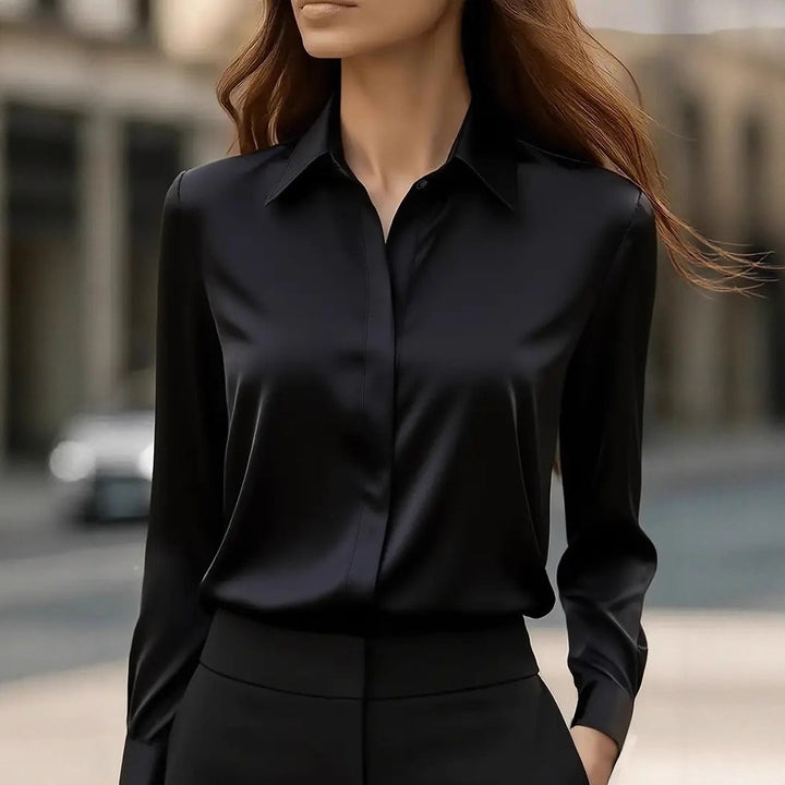 Women's button-front work blouse. Stylish & sophisticated, perfect for formal office wear. Long sleeve top.