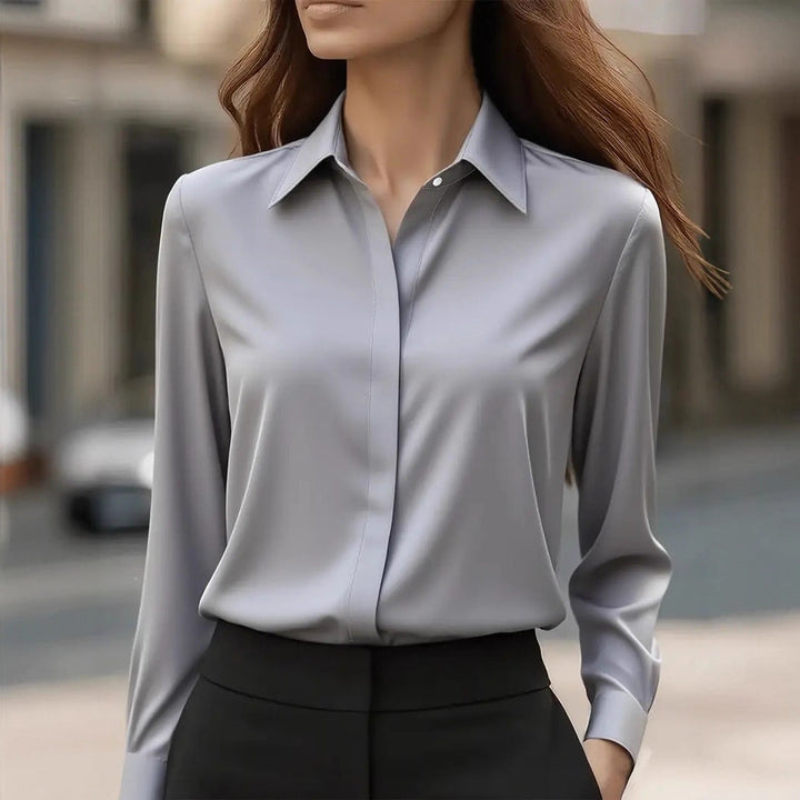 Elegant women's long sleeve blouse with button-front closure. Ideal for office, work, and evening events.
