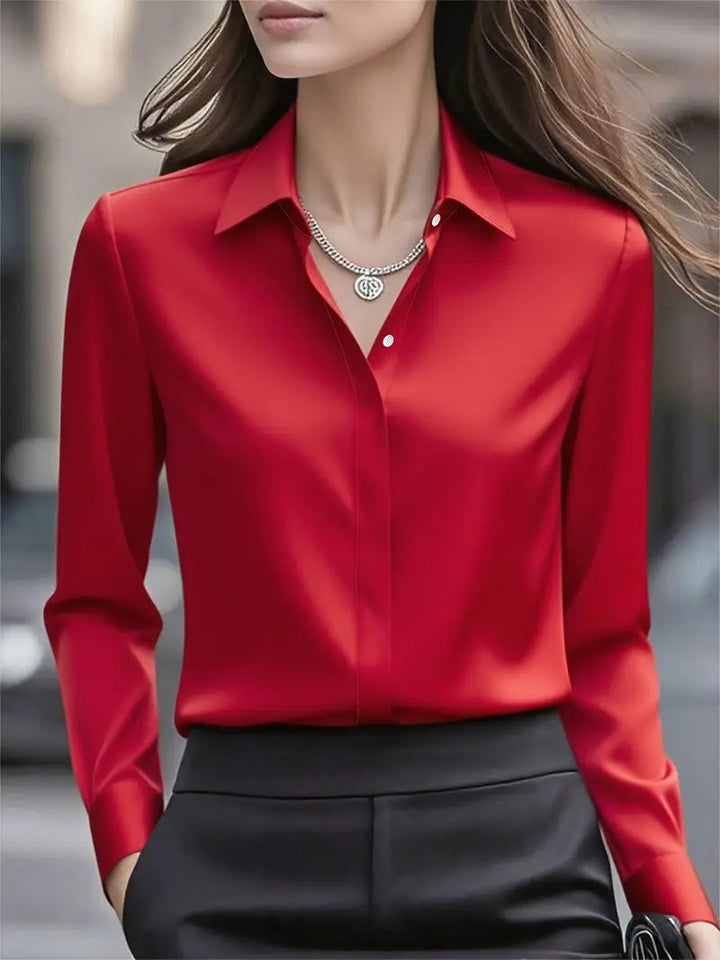 Formal women's button-front shirt. Elegant long sleeve blouse, perfect for office and professional wear.