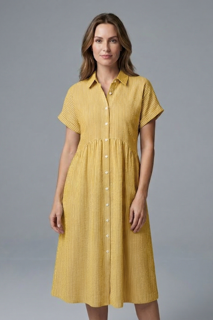 Detail shot of the elegant button-front and collar on a versatile women's midi dress.