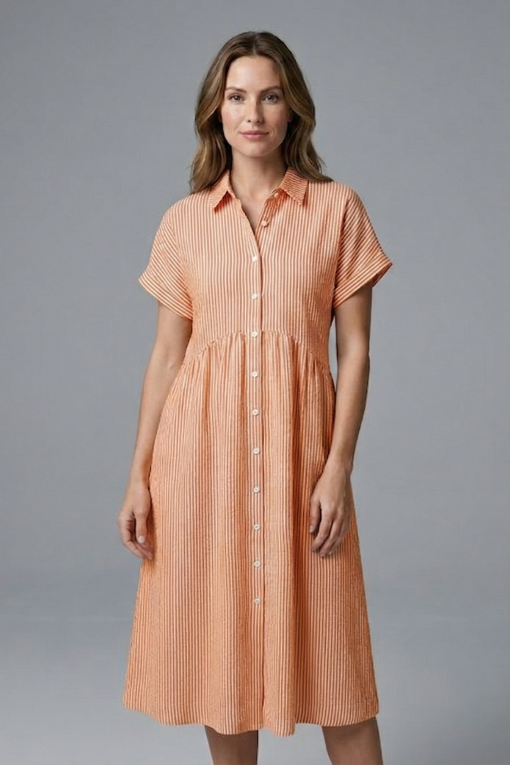 Woman modeling an elegant women's button-front collar midi dress, ideal for office or day wear.