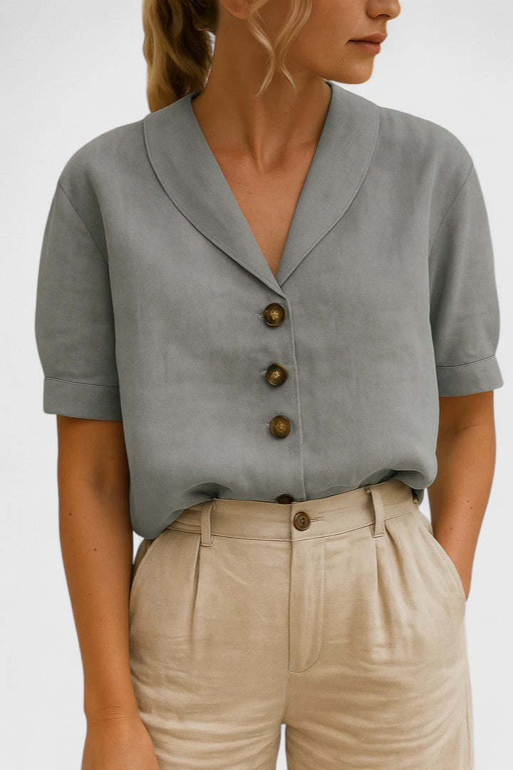 Chic women's button-up blouse, ideal for formal workwear or stylish casual outfits. Versatile elegant top.