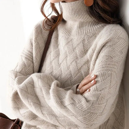 Elegant women's cascade turtleneck sweater with a chic chevron pattern, perfect for fall and winter fashion.