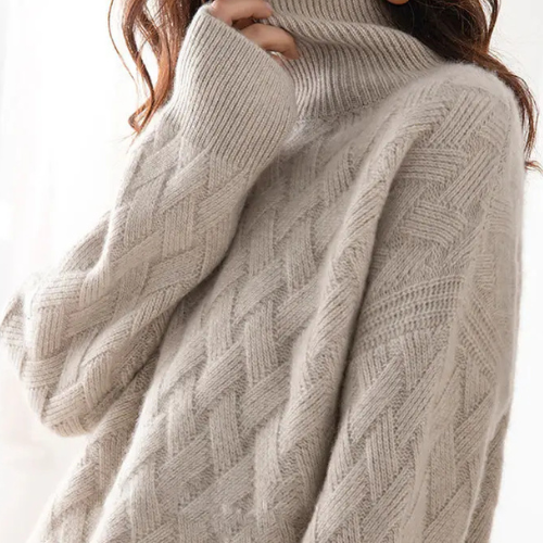 Cozy women's oversized turtleneck pullover, a warm and comfortable soft sweater for relaxed winter wear.